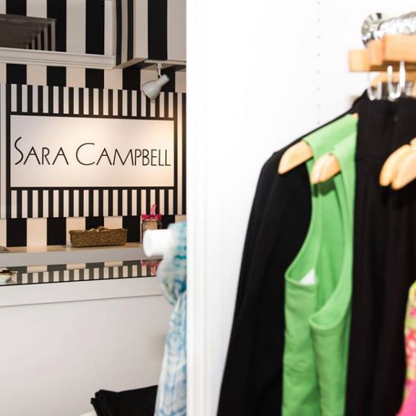 Stylist clothes stack the rack at a charming boutique.