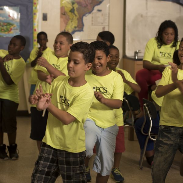 A group of elementary-aged boys perform a dance to a classroom-favorite song.